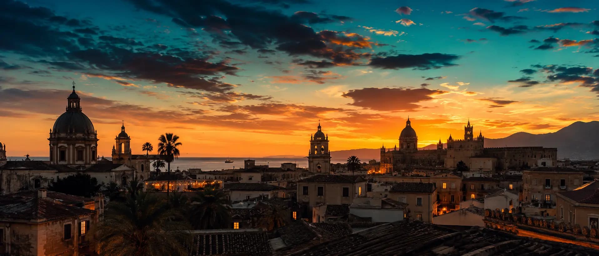 Warm sunset light over the rooftops and domes of Palermo's historic centre